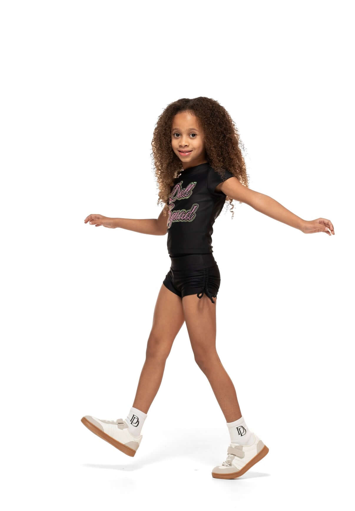 Black Scrunch Side - Short on a model, showcasing high-waisted design, scrunch sides, and cute bow ties.