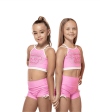 Bubblegum Pink -  Short, featuring two girls in matching pink crop tops and scrunch shorts with white bow ties.