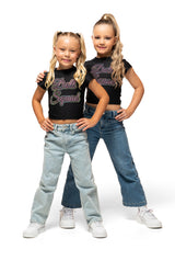 Two kids wearing Doll Squad Baby Tee, styled with jeans, showcasing comfort and trendy fashion.