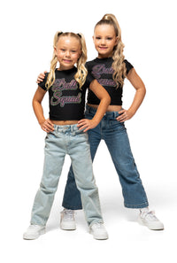 Two kids wearing Doll Squad Baby Tee, styled with jeans, showcasing comfort and trendy fashion.