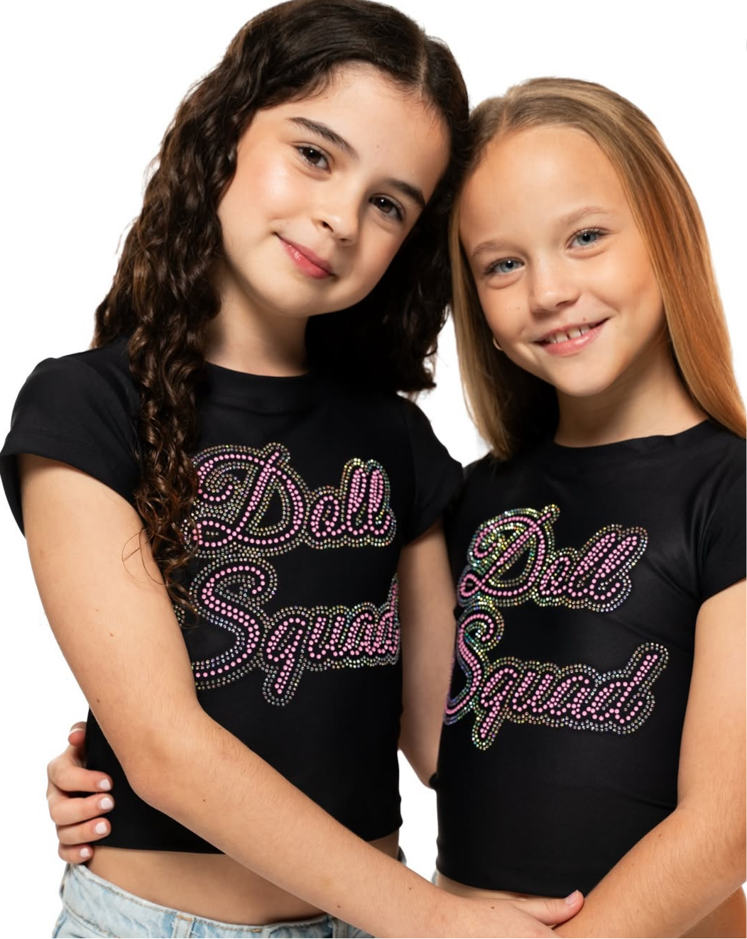 Two girls wearing Doll Squad Baby Tee in black with colorful rhinestone design, showcasing stylish and comfortable fashion.