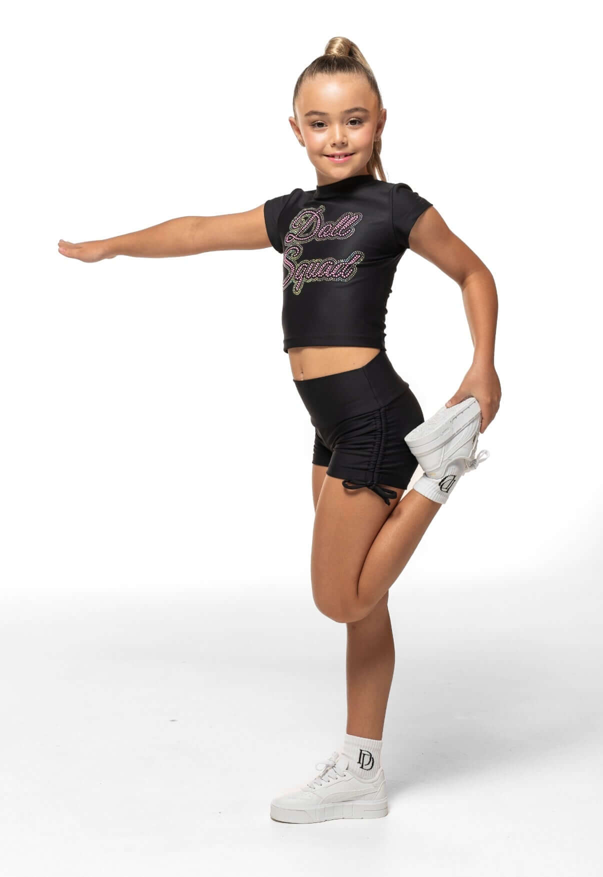 Black Scrunch Side - Short model showcasing high-waisted shorts with scrunch sides and bow ties.