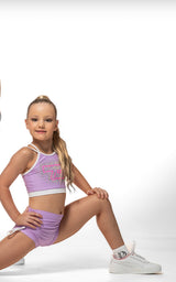 Cute child modeling the Lilac Sky Crop, featuring criss-cross neckline and sparkly rhinestones.