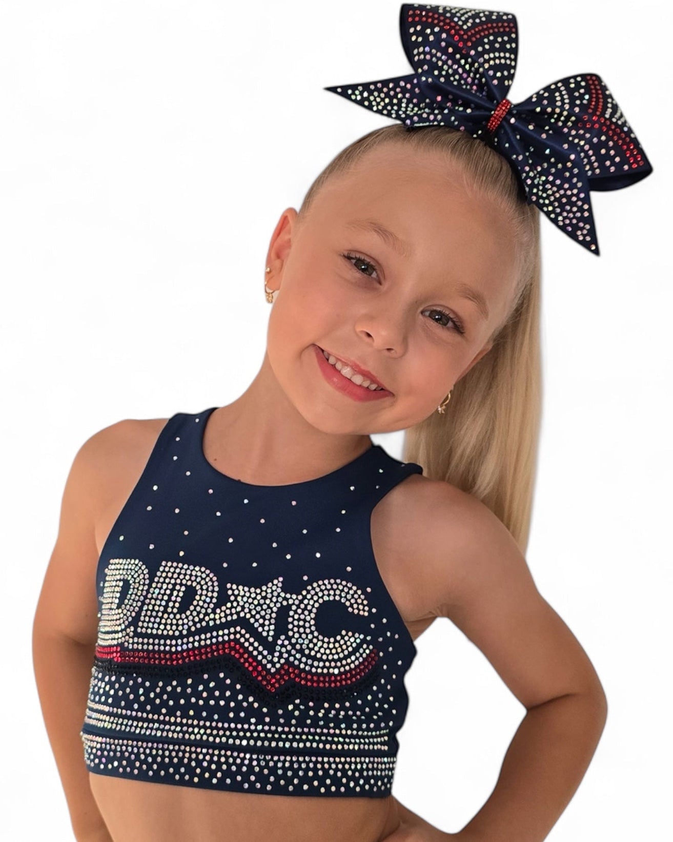 DDC Navy Rhinestone - Crop featuring a smiling girl with a crystal-embellished top and matching bow.