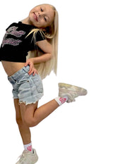 Girl wearing Doll Socks with a cute outfit, showcasing the stylish pink love heart design and comfortable style.