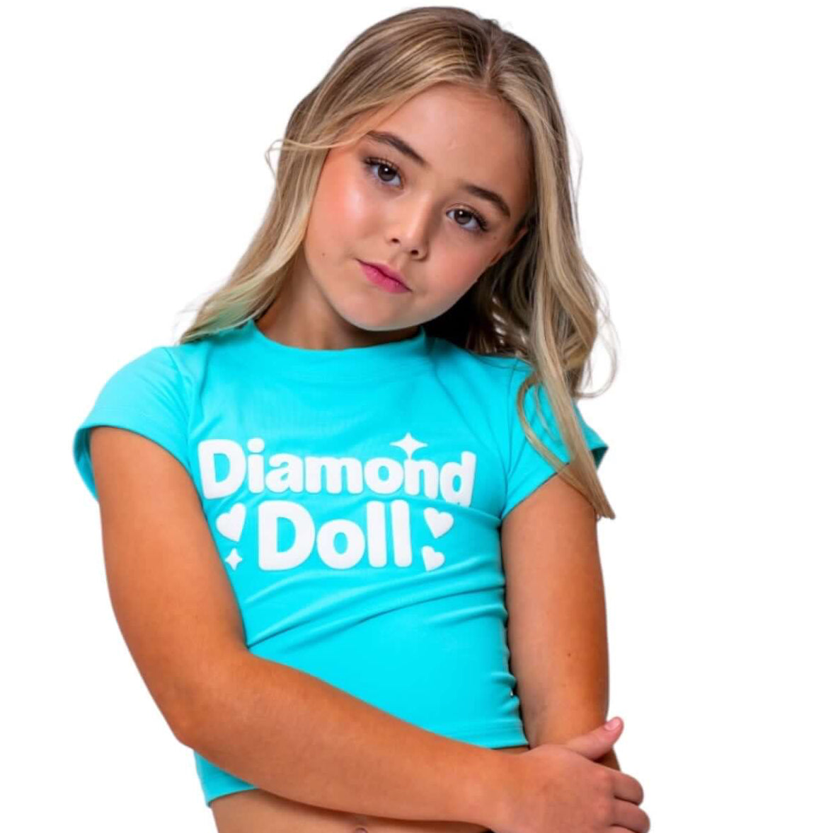 Puff Print Baby Tees featuring Diamond Doll logo on a girl in a blue sherbet fitted tee and black shorts.