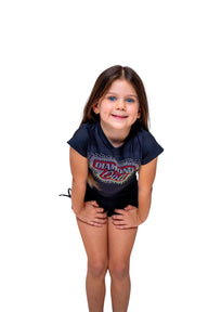 Girl wearing a Diamond Doll Baby Tee, a fitted top designed for comfort and style, showcasing a playful pose.
