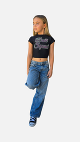 Girl wearing Doll Squad Baby Tee with denim jeans, showcasing trendy and comfortable style.