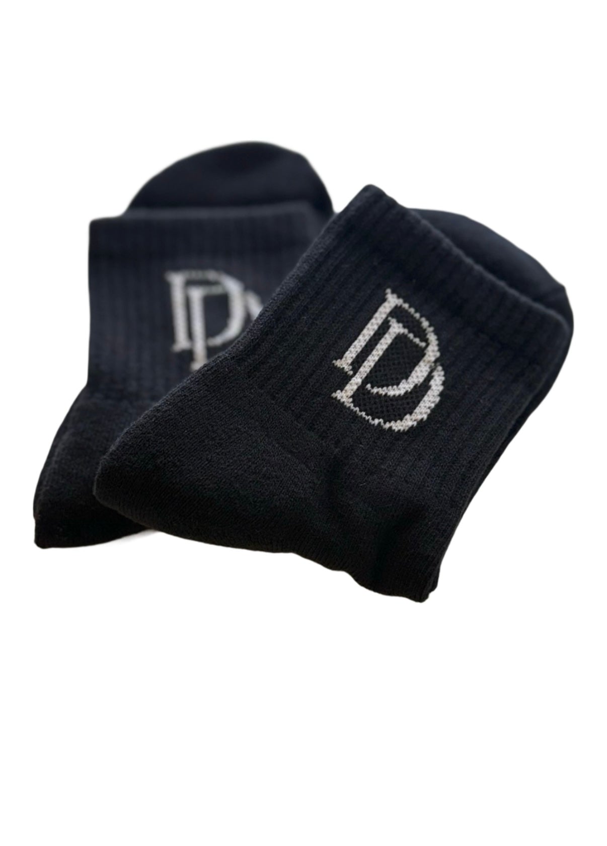 DD Socks in black with logo, ideal for active kids with breathability and moisture-wicking technology.