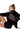 Person wearing a black hoodie with 'DOLL' text, sitting on a white background