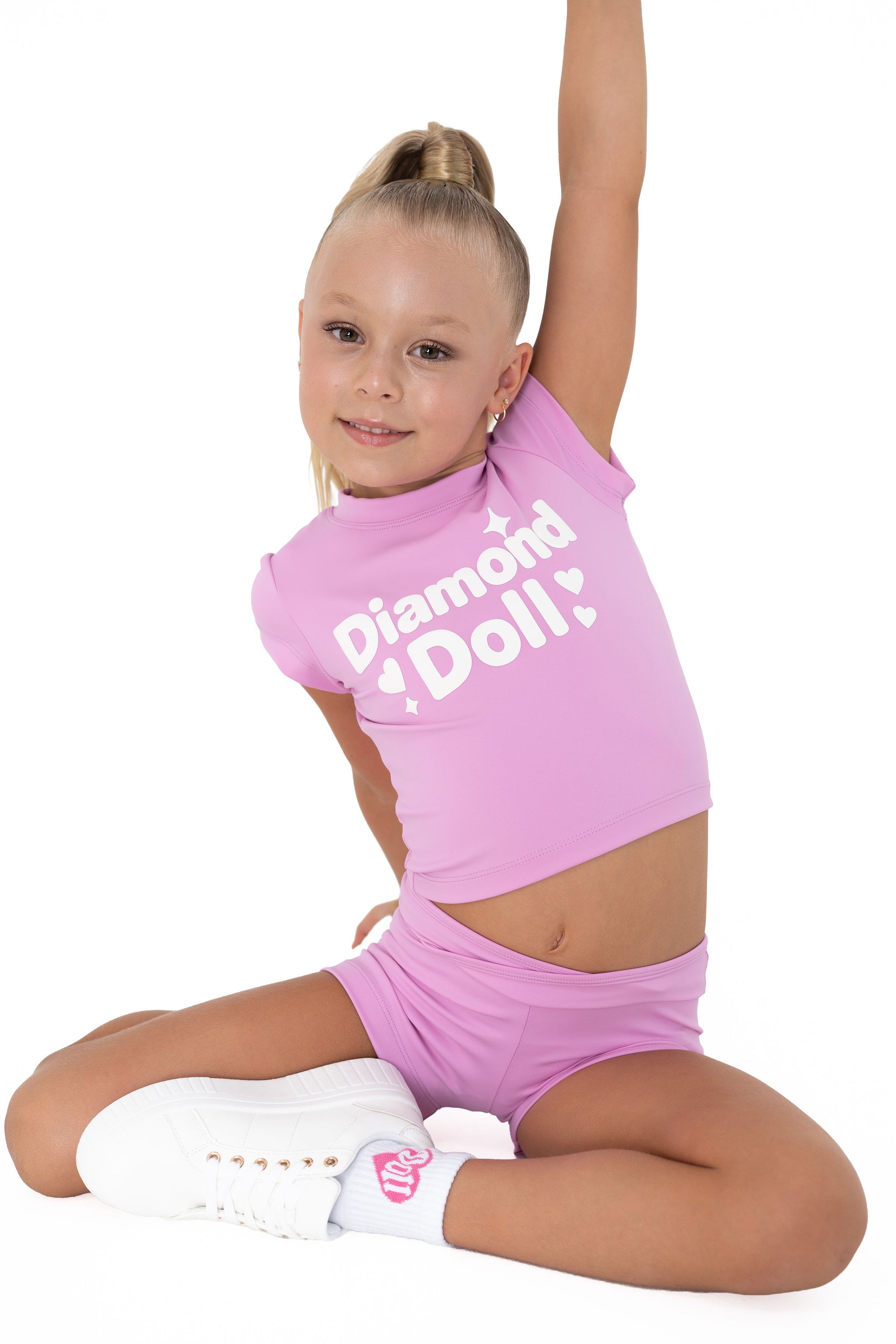 Puff Print Active Tee worn by girl in bubblegum pink, featuring a bold 'Diamond Doll' logo.